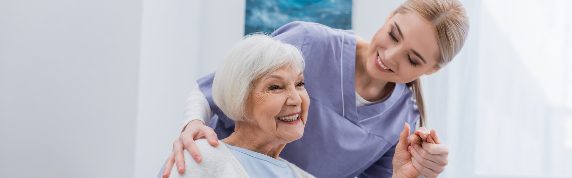 caregiver looking at the senior woman